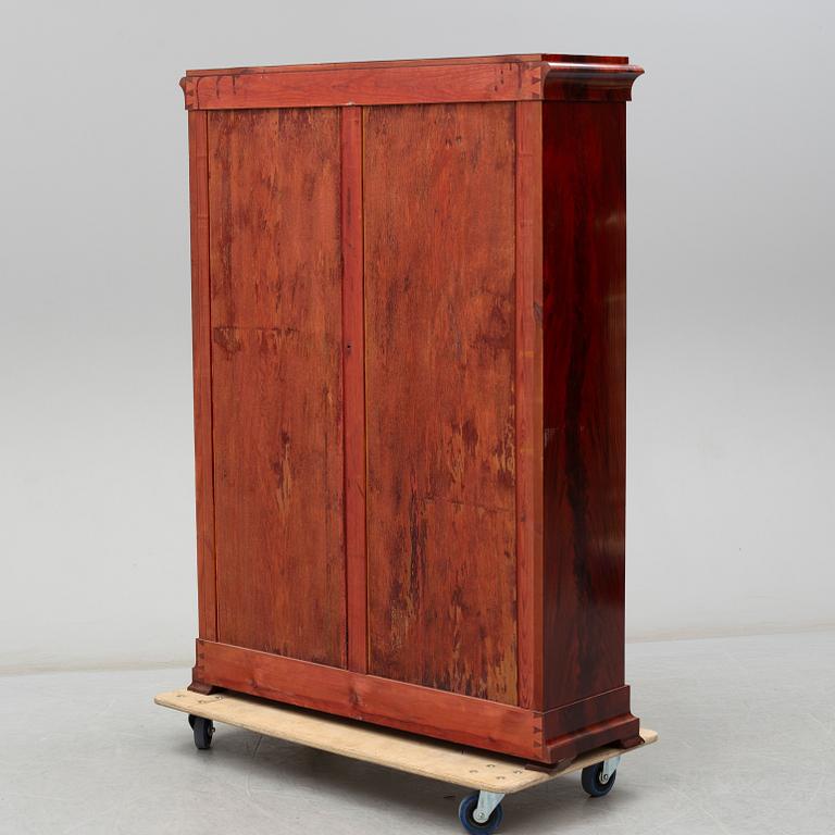 A first half of the 20th century mahogany veneered shelf.