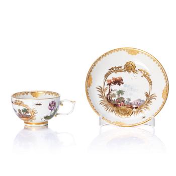 329. A Meissen porcelain cup with stand, 18th Century.