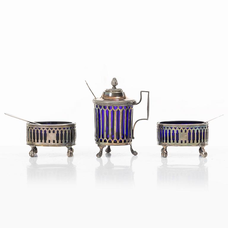 Two silver salt cellars, and a mustard pot, French hallmarks, late 18th Century.
