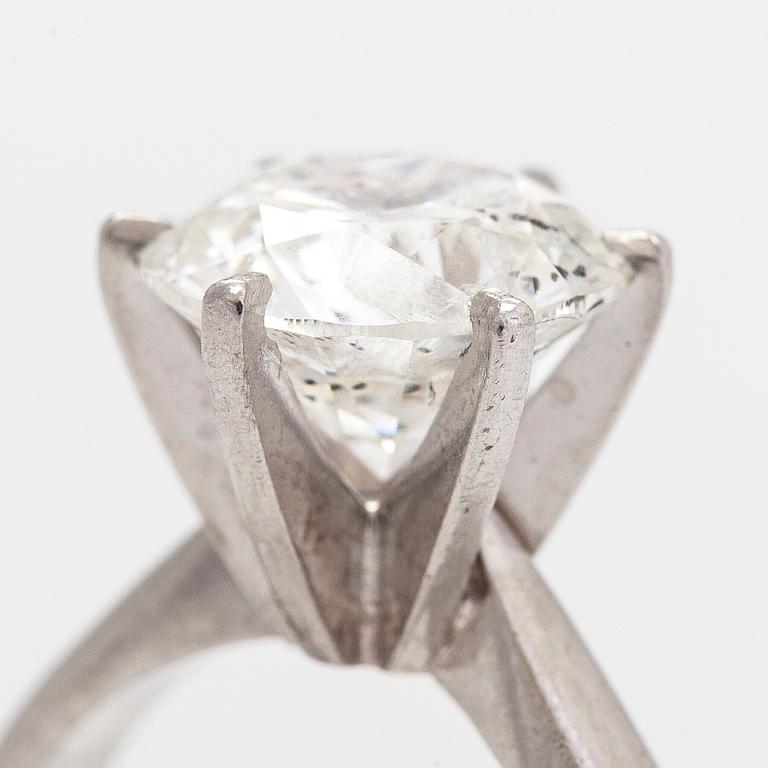 A platinum ring, with a brilliant-cut diamond approximately 3.10 ct. Domino Jewellery, Birmingham, England.