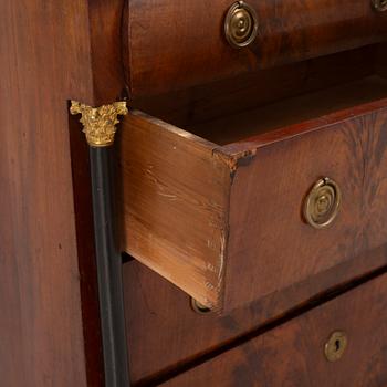 An Empire chest of drawers, first half of the/mid 19th century.