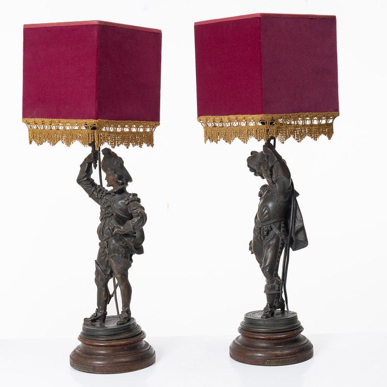 Auguste Poitevin, after, a pair of "Frondeur" sculptures/tablelamps, France, early 20th century.