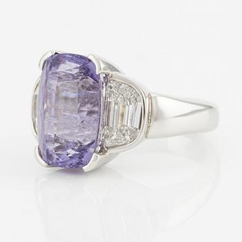 A Gaudy platinum ring with a faceted purple tourmaline and step-cut diamonds.