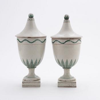 A pair of earthenware urns, 20th century.