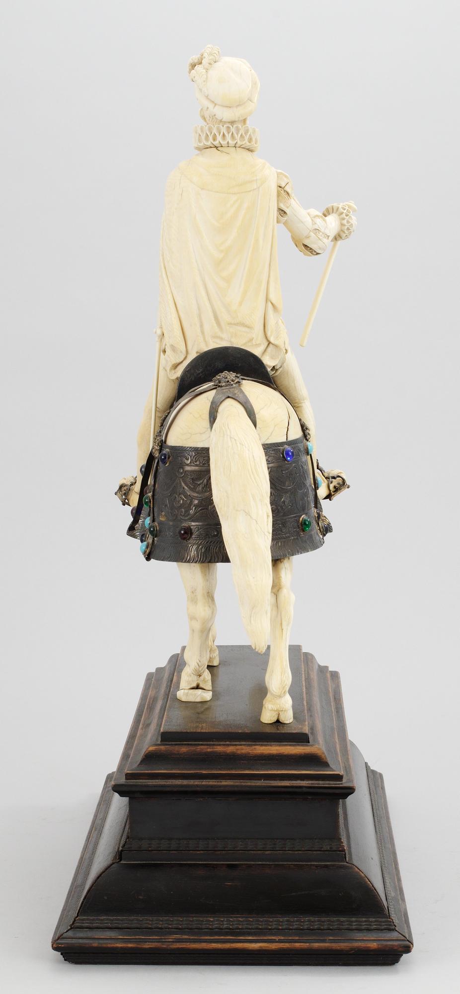 A late 19th century equestrian ivory, wood and metal statue.