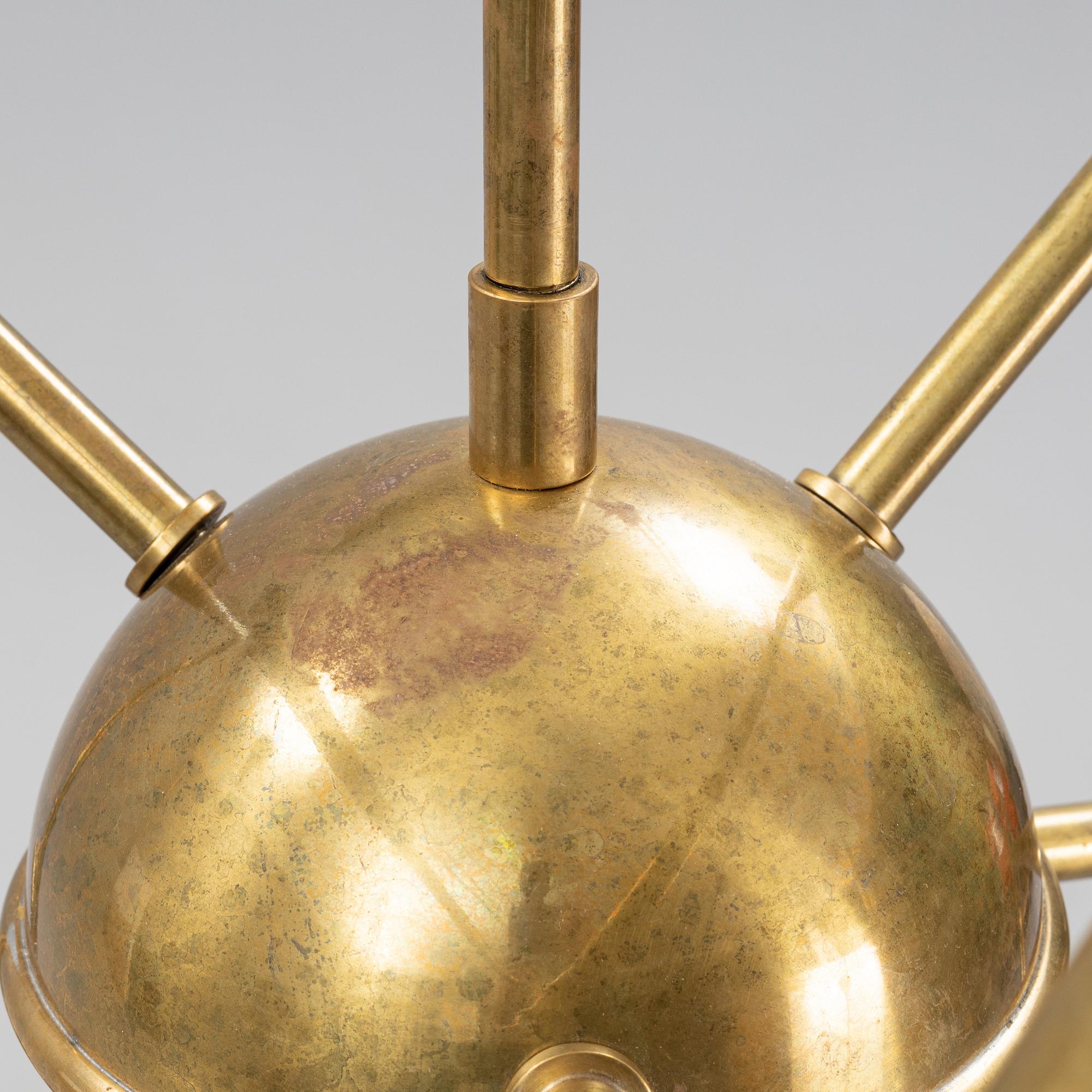 A mid 20th Century brass celiling light.