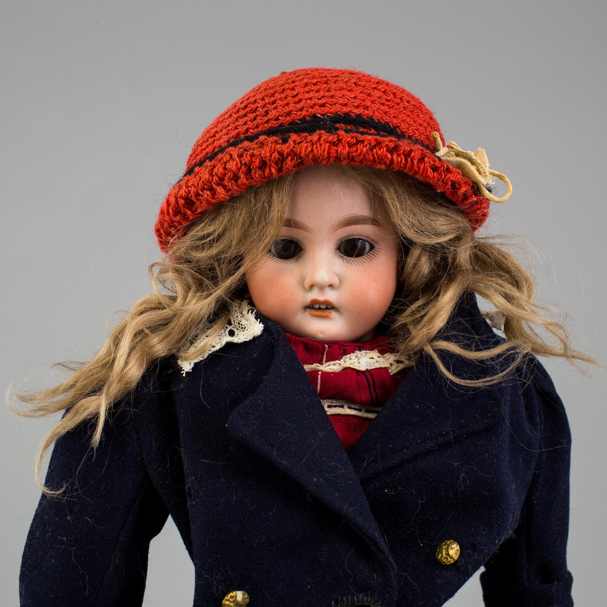 An Armand Marseille 3200 DEP Made in Germany bisque head doll.