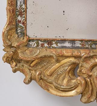 A Swedish giltwood and polychrome-painted Rococo mirror, later part of the 18th century.