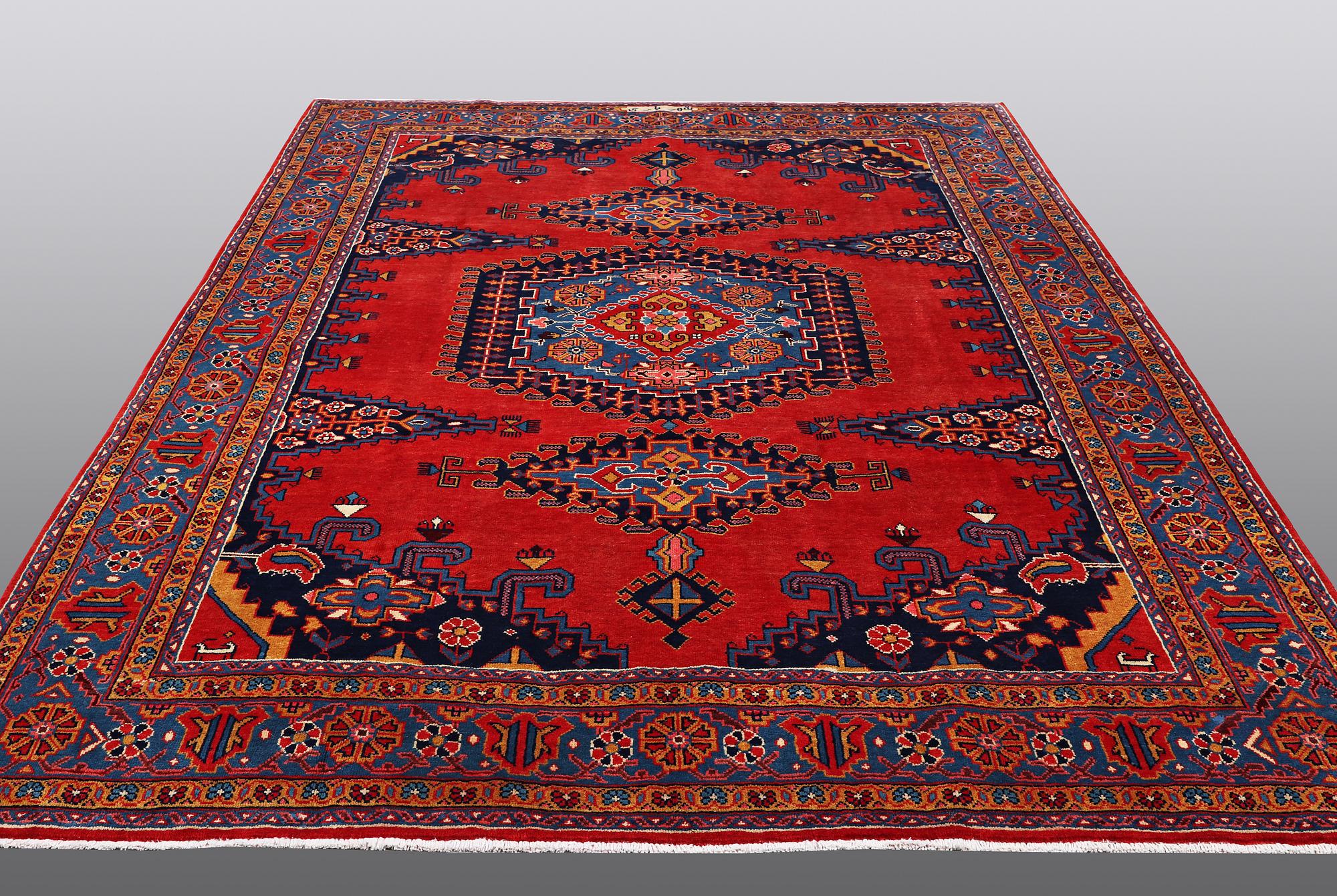A CARPET, Wiss Signed Sharbani.  327 x 227 cm.