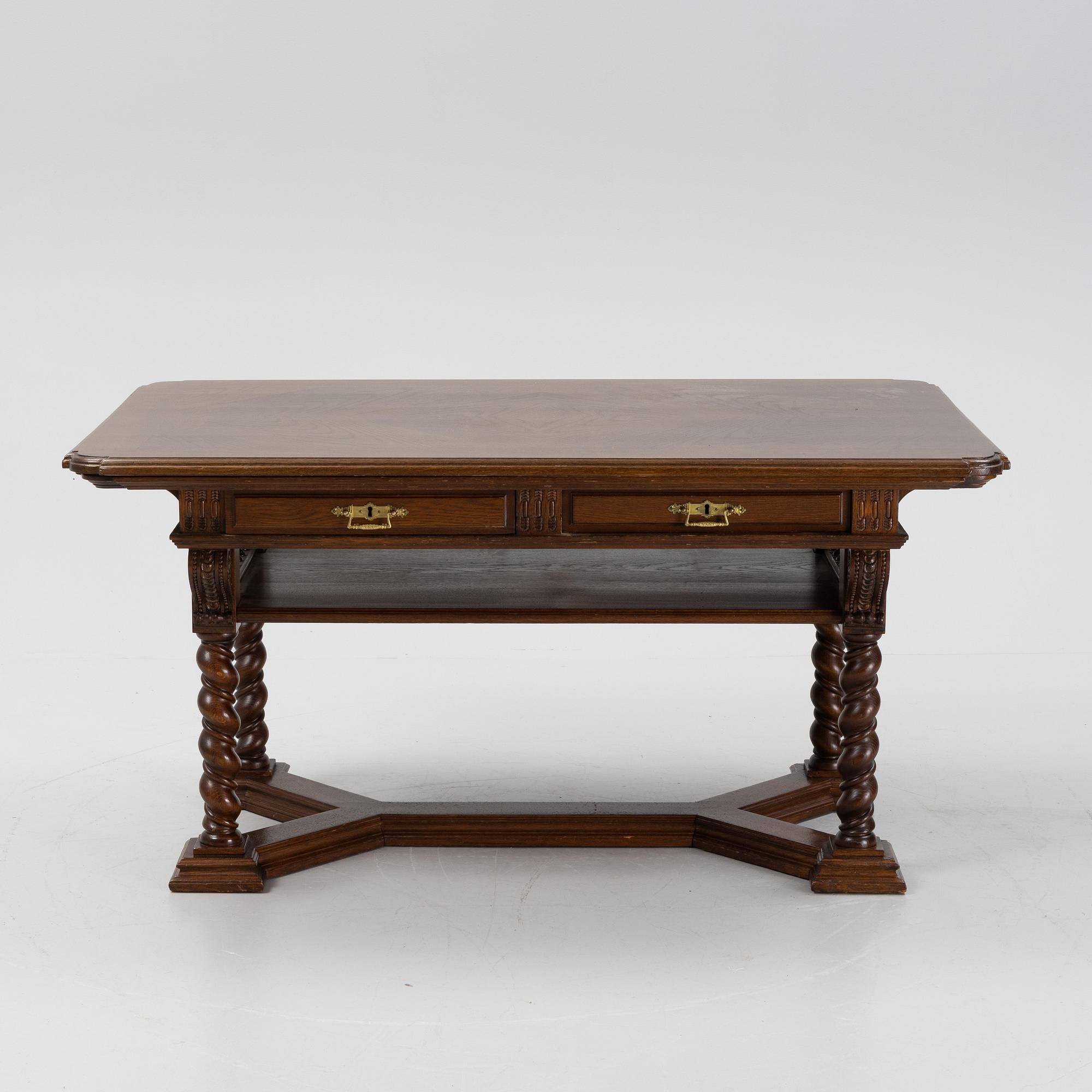 A writing desk / library table, circa 1900.