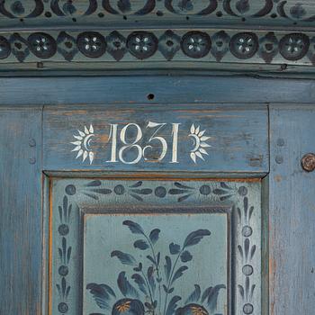 A painted Swedish corner cabinet, Hälsingland, dated 1831.