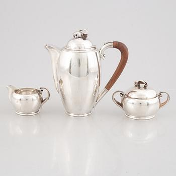 A Swedish Sterling Silver Coffee Pot, Creamer and Sugar Bowl, mark of Nordisk Silverkonst, Helsingborg 1948.