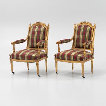 A pair of Louis XVI-style armchairs, first half of the 20th century.