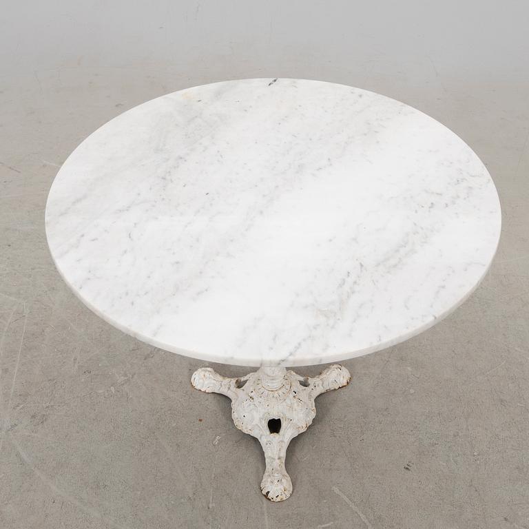 A marble and cast iron table 20th century.