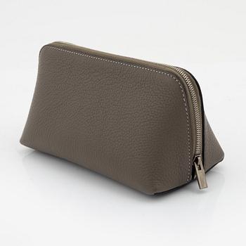 Céline, A small cosmetic pouch in beige leather.