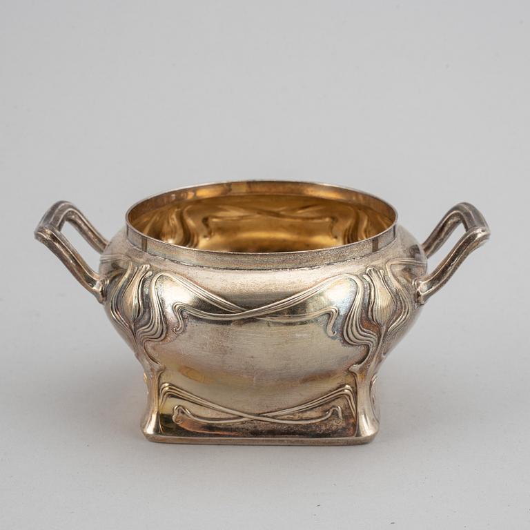 An art nouveau silver coffee pot, sugar bowl and creamer, mark of CF Källström, Malmö 1901.