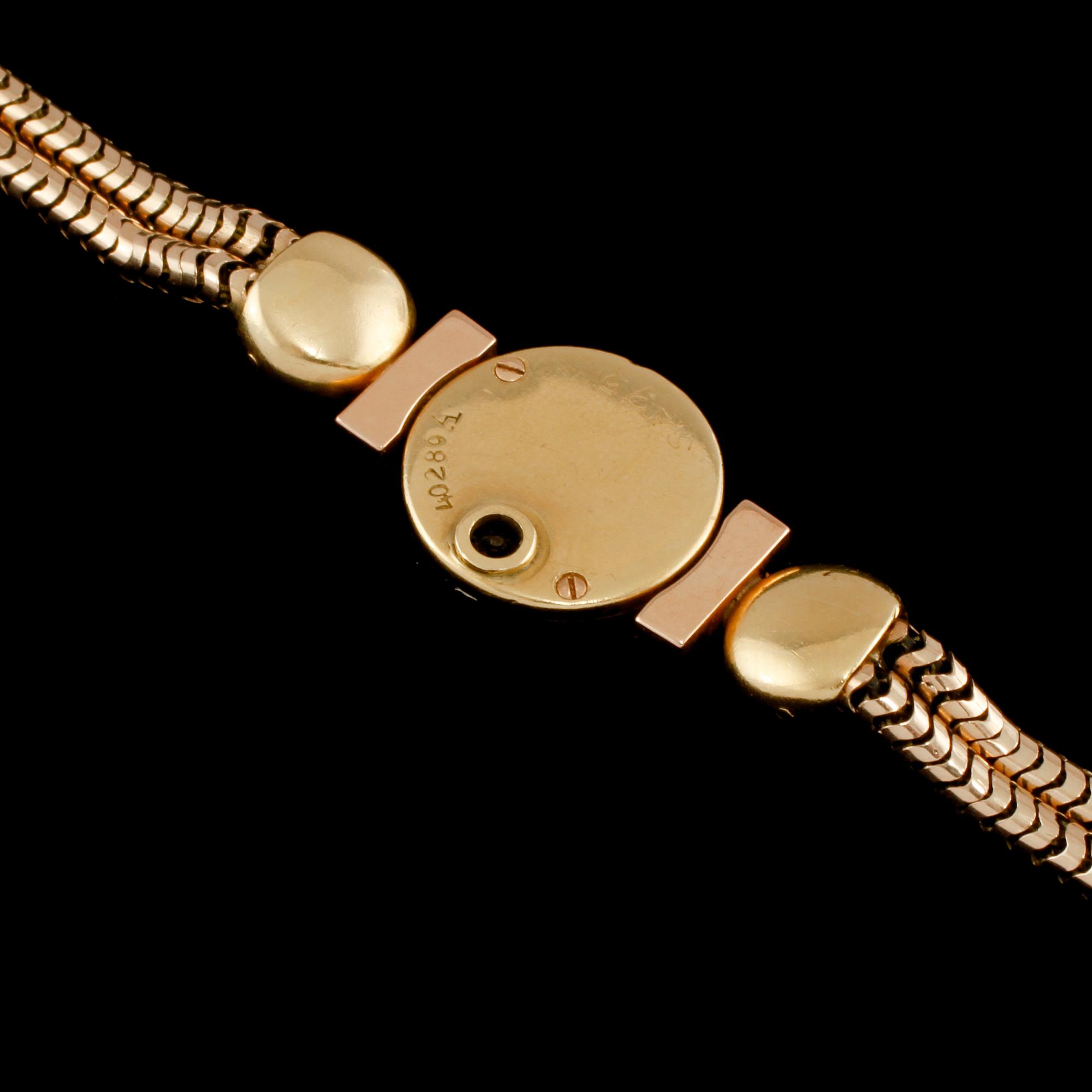 ARMBANDSUR, 18K samt 8K guld med fasettslipade rubiner, Jaeger-LeCoultre, 1900-talets första hälft.