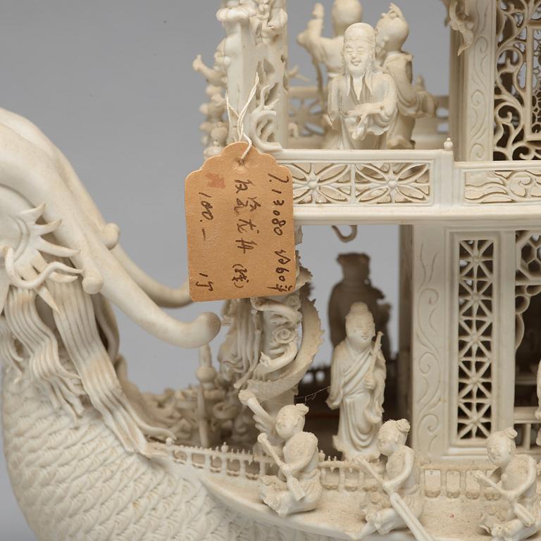 A biscuit porcelain dragon boat of 'Assembly of Immortals', Qing dynasty, Daoguang, signed Chen Guozhi, 19th century.