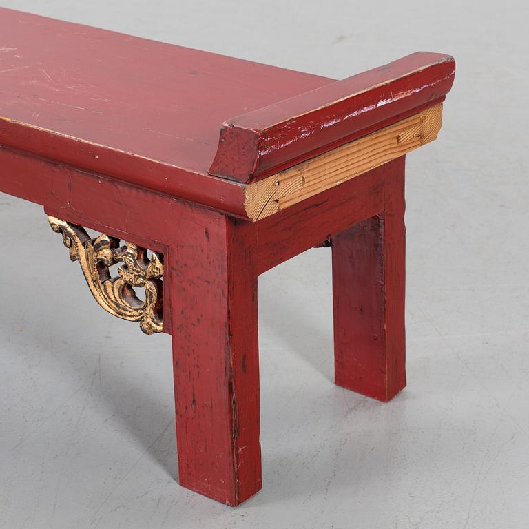 A Chinese 20th century painted wooden bench.