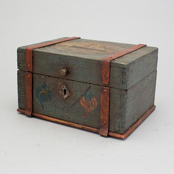 A painted box with motif from the Swedish American Line early 20th century.