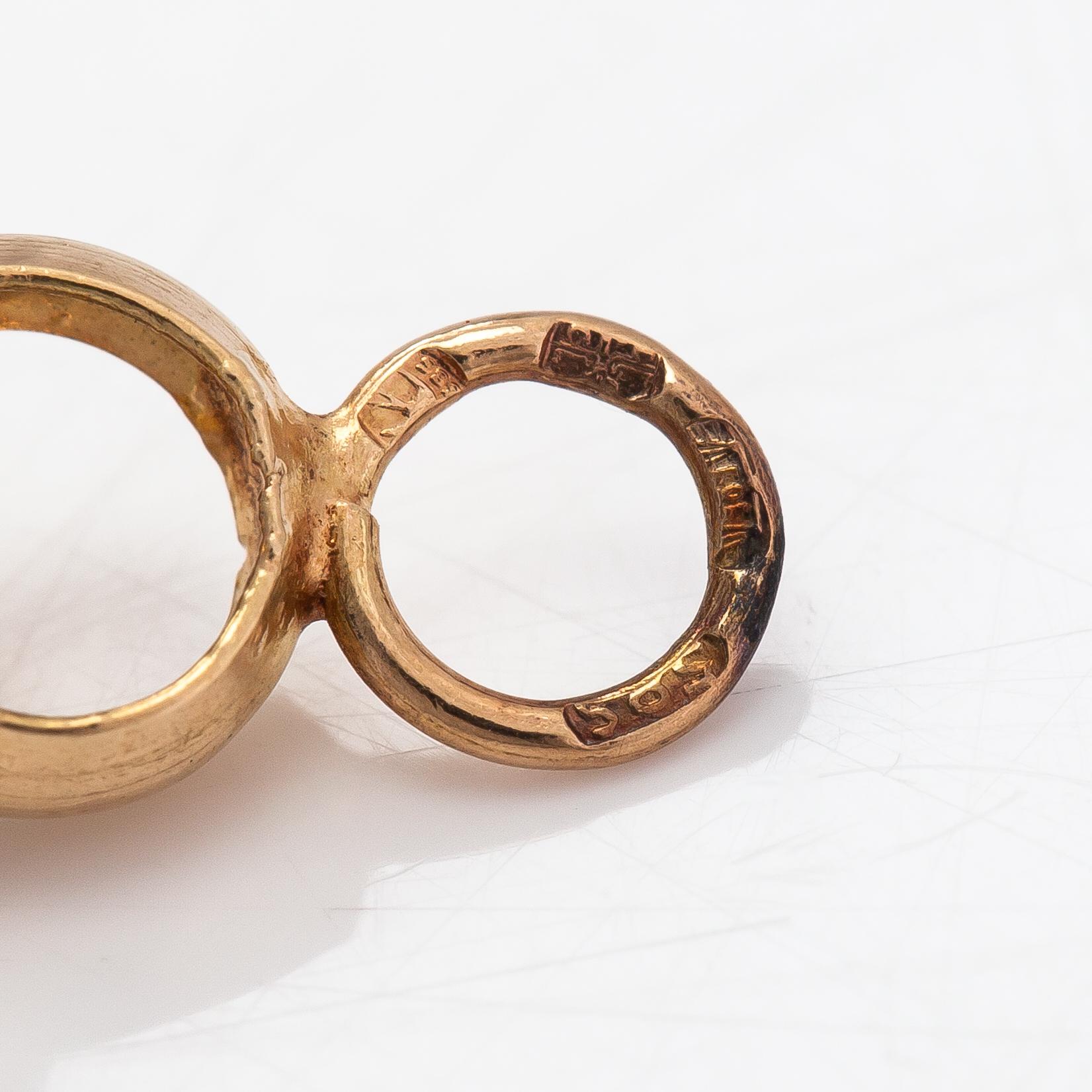 A 14K gold bracelet.