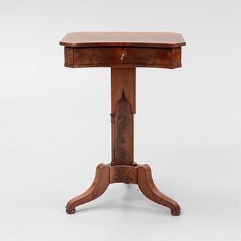 A mid 19th century mahogany work table.