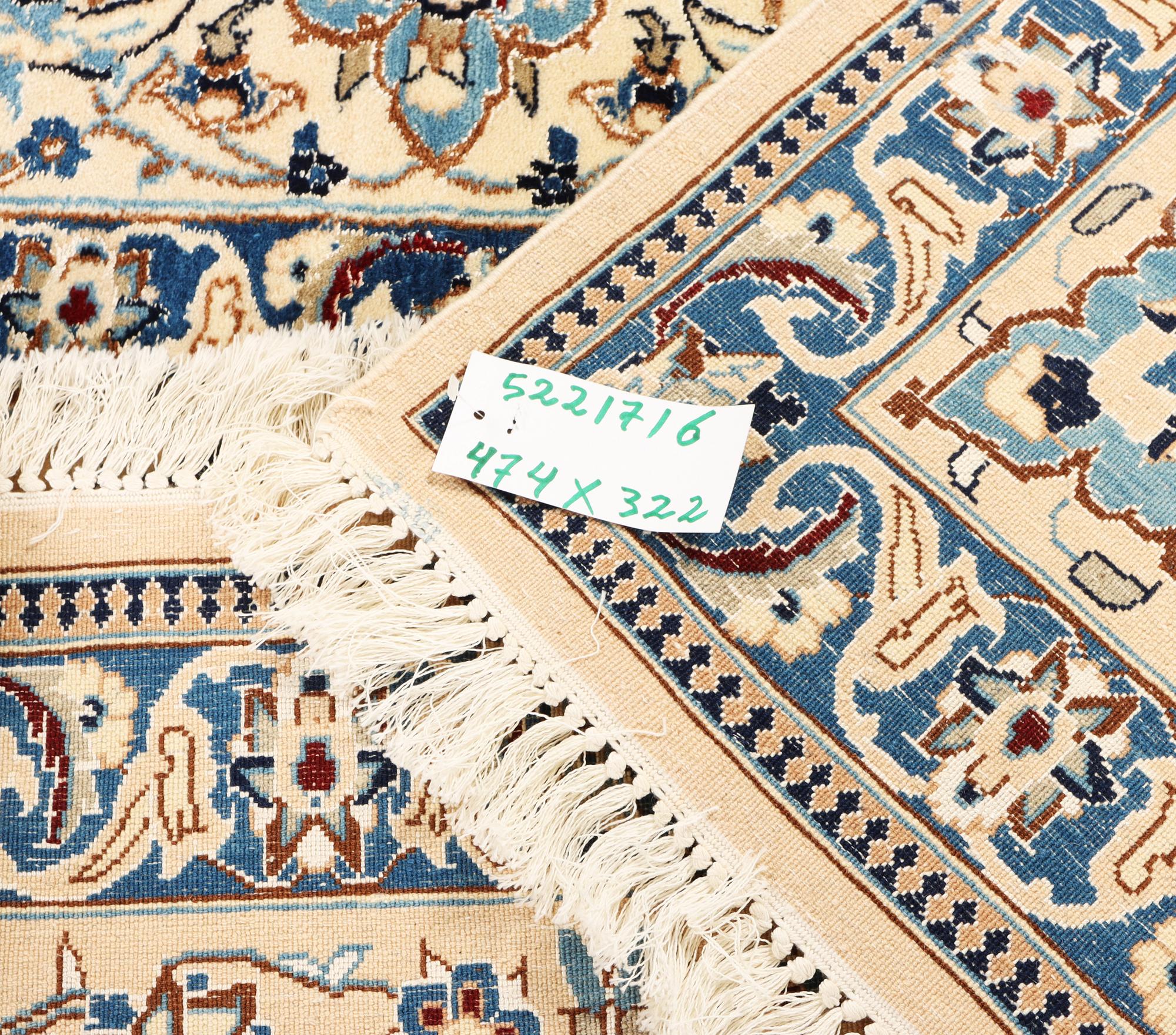 A Nain, part silk carpet, c. 474 x 322 cm.