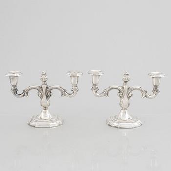 A pair of Swedish silver candelabras, marks of CG Hallberg, Stockholm 1959.