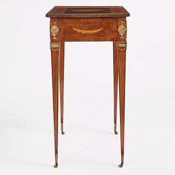 A Gustavian marquetry and gilt brass-mounted table by G. Iwersson (master in Stockholm 1778-1813).