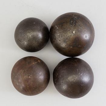 FOUR IRON BULLETS, 18th century.