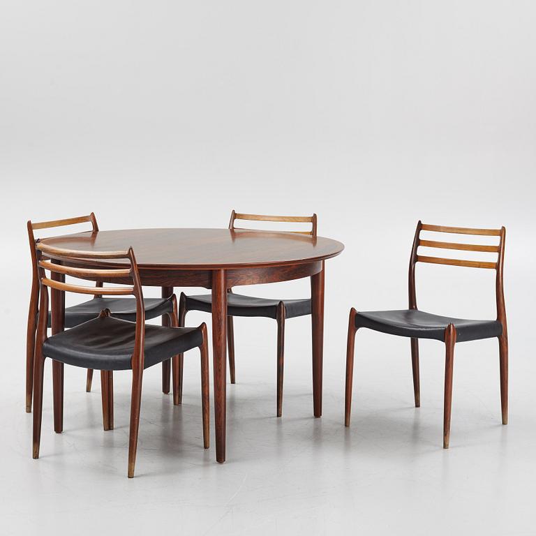 Niles Otto Møller, a rosewood veneered table with four chairs, JL Møller, Denmark, 1950's/60's.