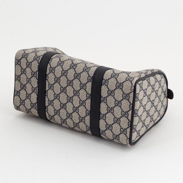 Gucci, a monogram canvas bag.