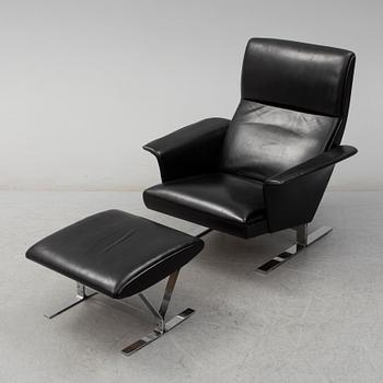 A second half of the 20th century easy chair and stool by Georg Thams, Vejens Polstermöbelfabrik, Denmark.