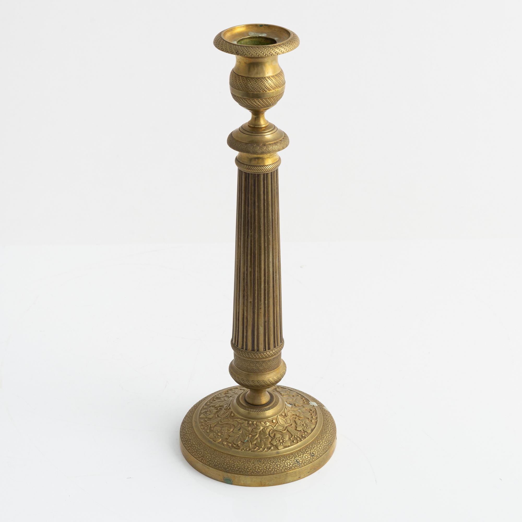 A brass Empire candlestick, first half of the 19th century,