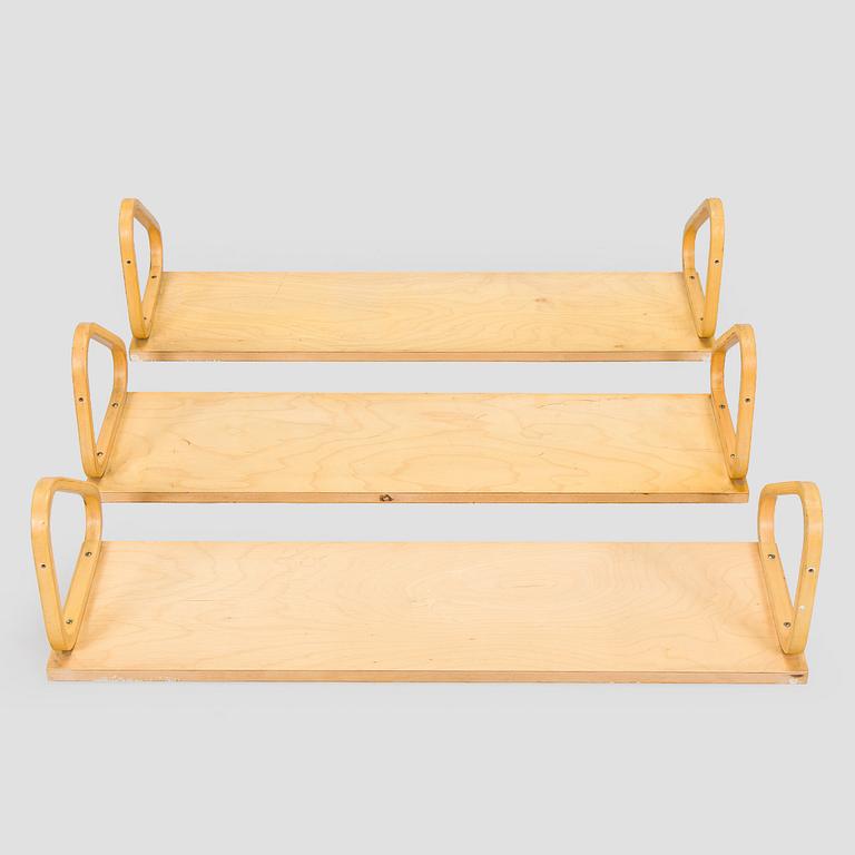 Alvar Aalto, three '112B' shelves, Artek, late 20th century.