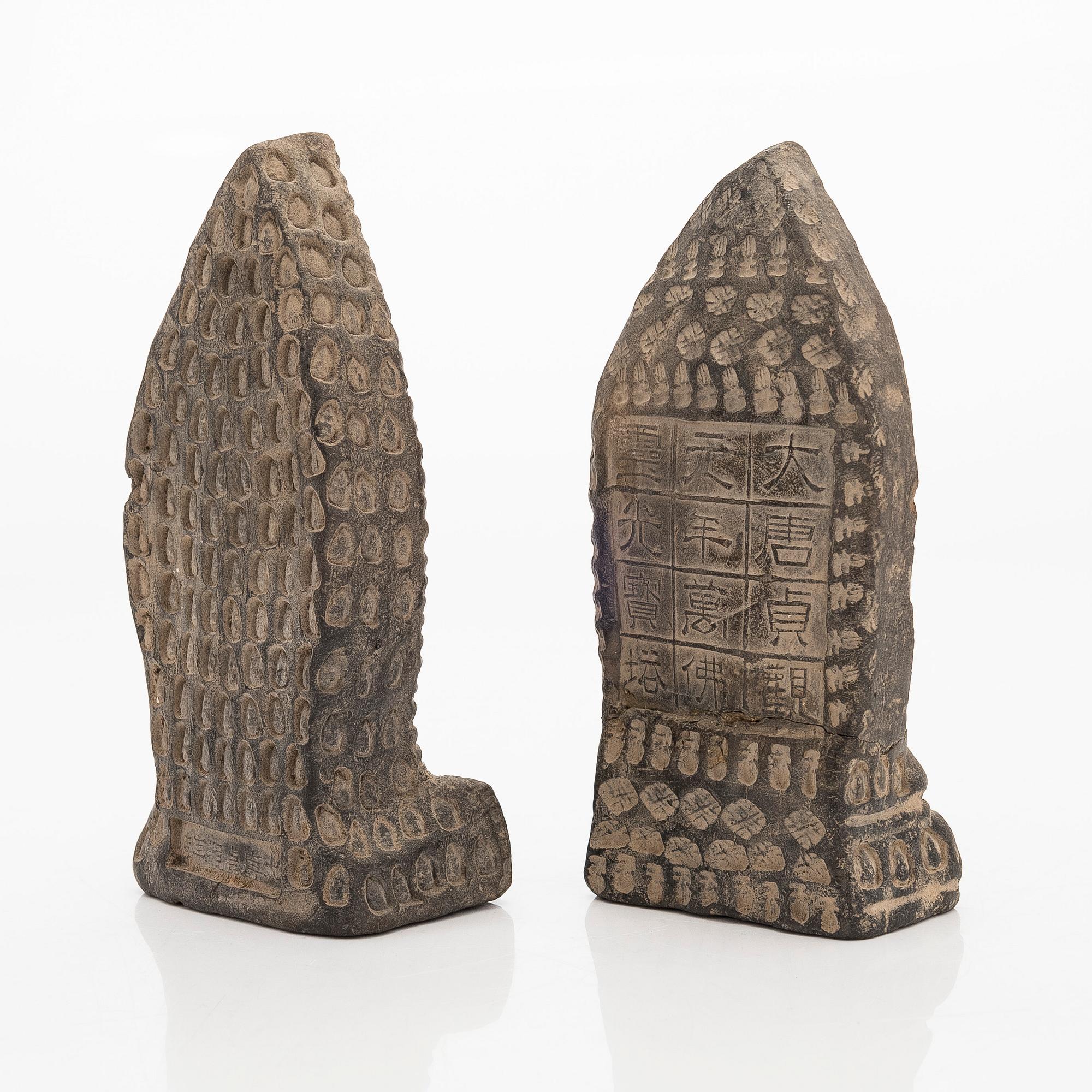 Two steles/tsa tsas, presumably circa 1900.