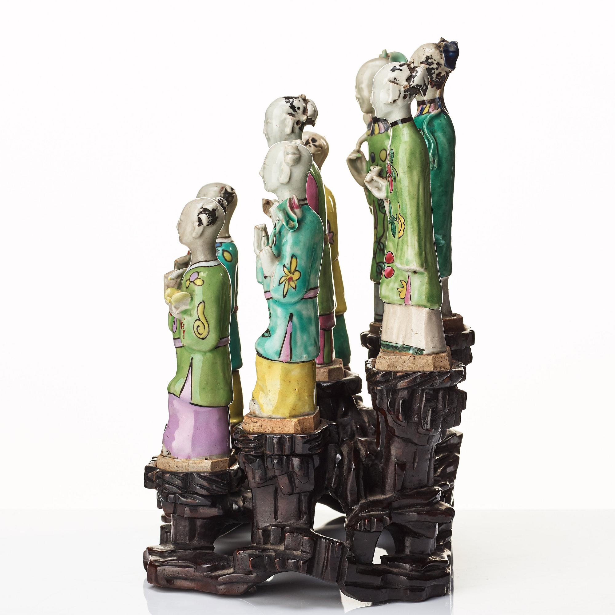A group of eight immortals on  wooden stand, Qing dynasty, 19th Century.