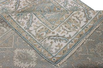 An oriental carpet with Mamluk design, c. 304 x 249 cm.