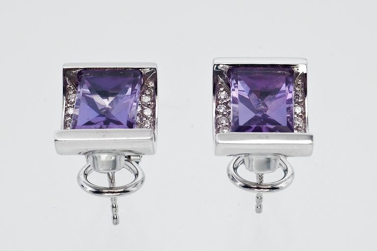 A PAIR OF AMETHYST EAR STUDS.