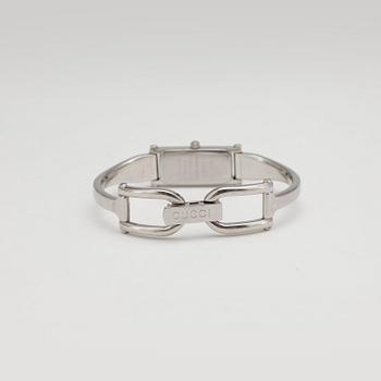 GUCCI, a wristwatch.