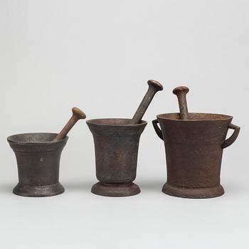 A set of three cast iron mortars around 1900.