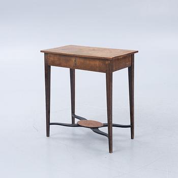 A late Gustavian burr-alder table, circa 1800.