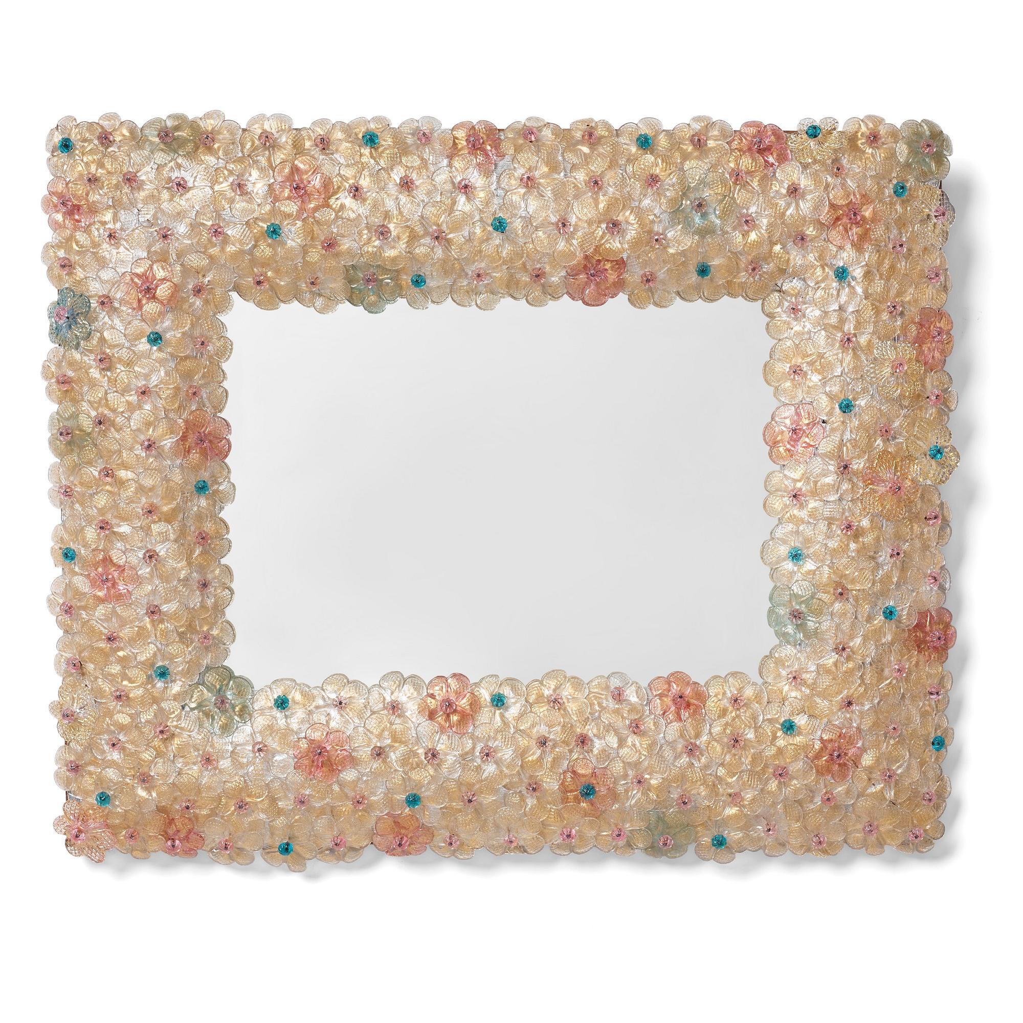 An Italian mid century modern glass framed mirror.
