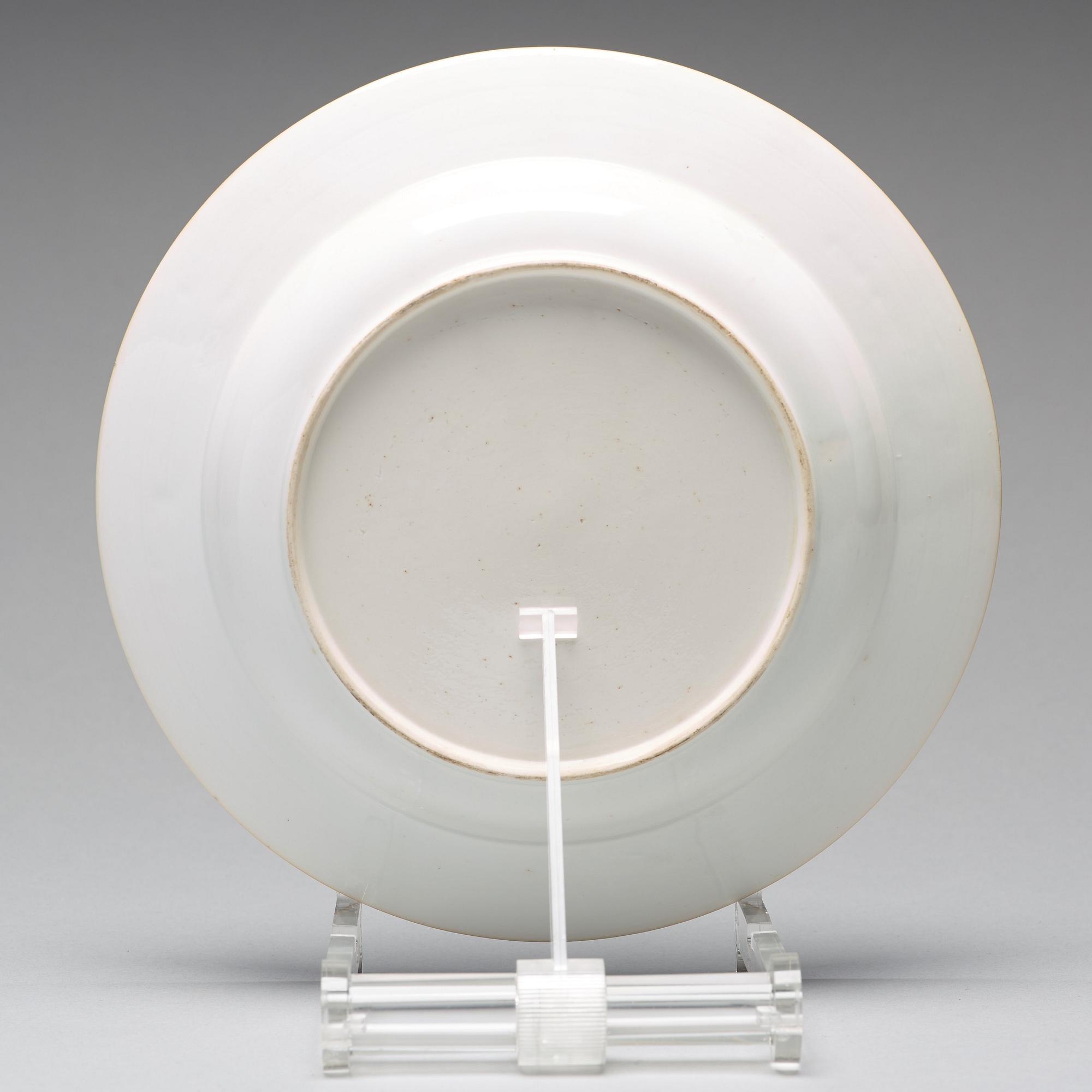 A set of eight blue and white armorial soup dishes, Qing dynasty, 18th Century.