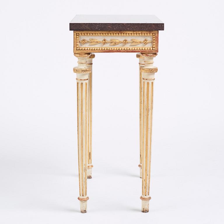 A late Gustavian console table in the manner of P Ljung, late 18th century. Stone top in porphyry.