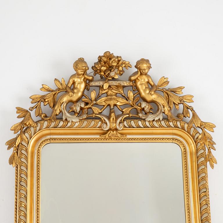 A Rococo revival mirror, late 19th Century.