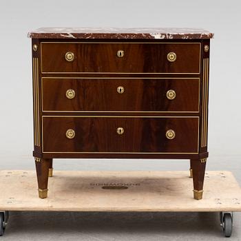 a 20th century gustavian style chest of drawer.