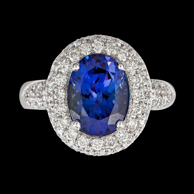 An untreated tanzanite, 3.74 cts, and brilliant cut diamonds, total carat weight circa 1.75 cts, ring.