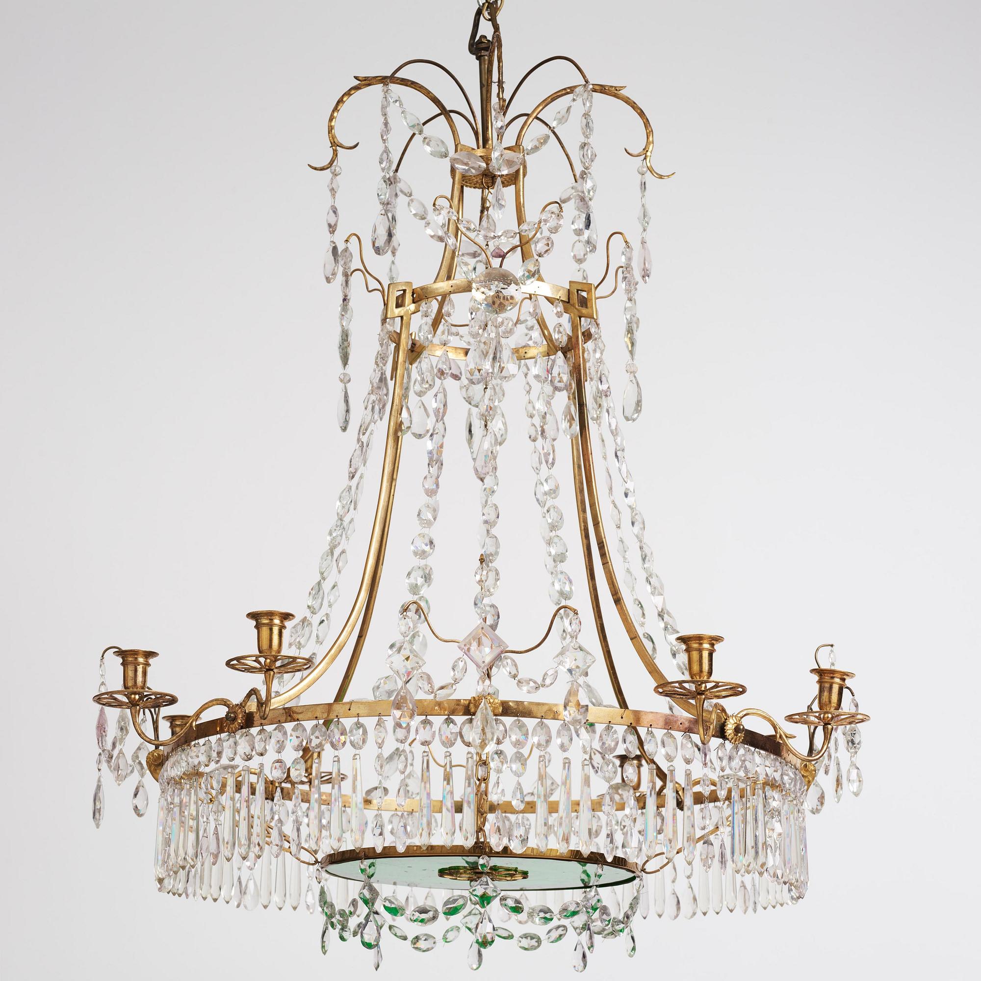 A German Louis XVI ormolu and cut-glass nine-light chandelier attributed to Johann Christoph Ermisch, late 18th century.