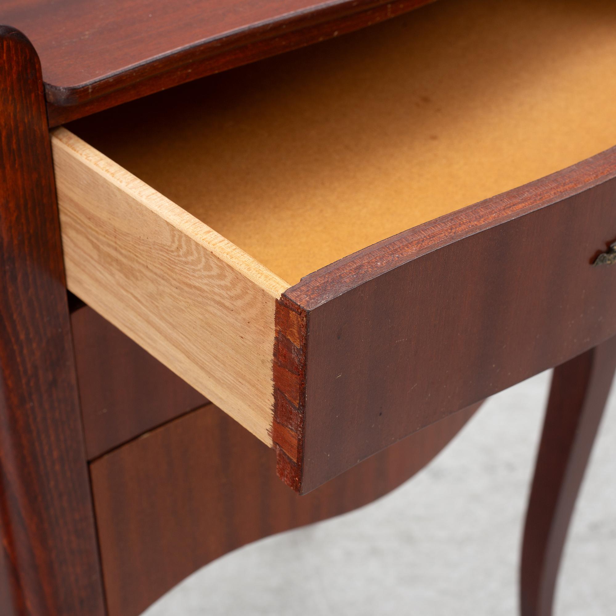 A pair of Rococo style bedside tables, second half of the 20th Century.